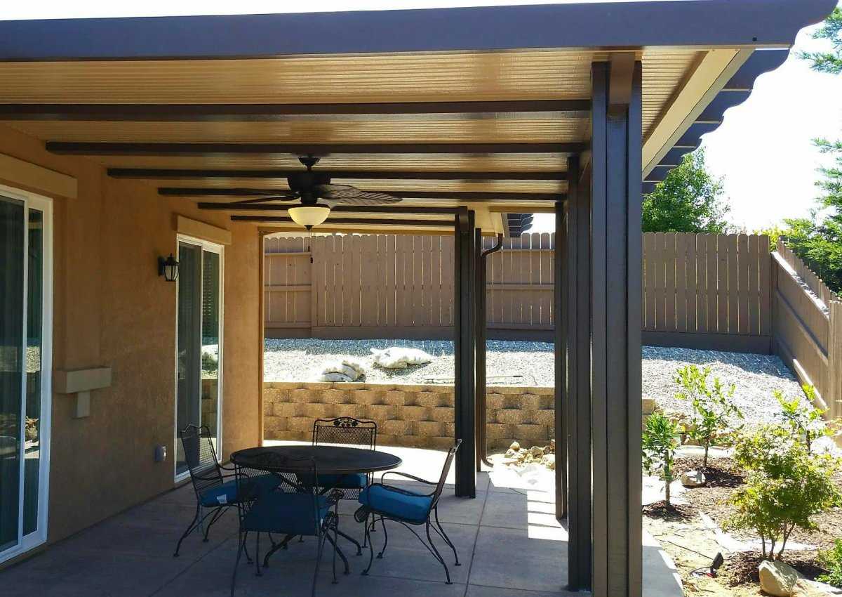 Solid aluminum patio cover with ceiling fan on a Sacramento home