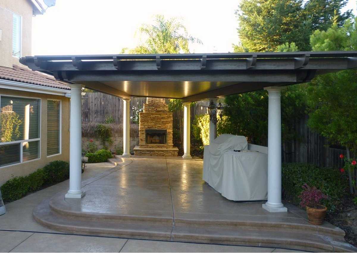 Custom solid aluminum patio cover with outdoor fireplace in the Sacramento area
